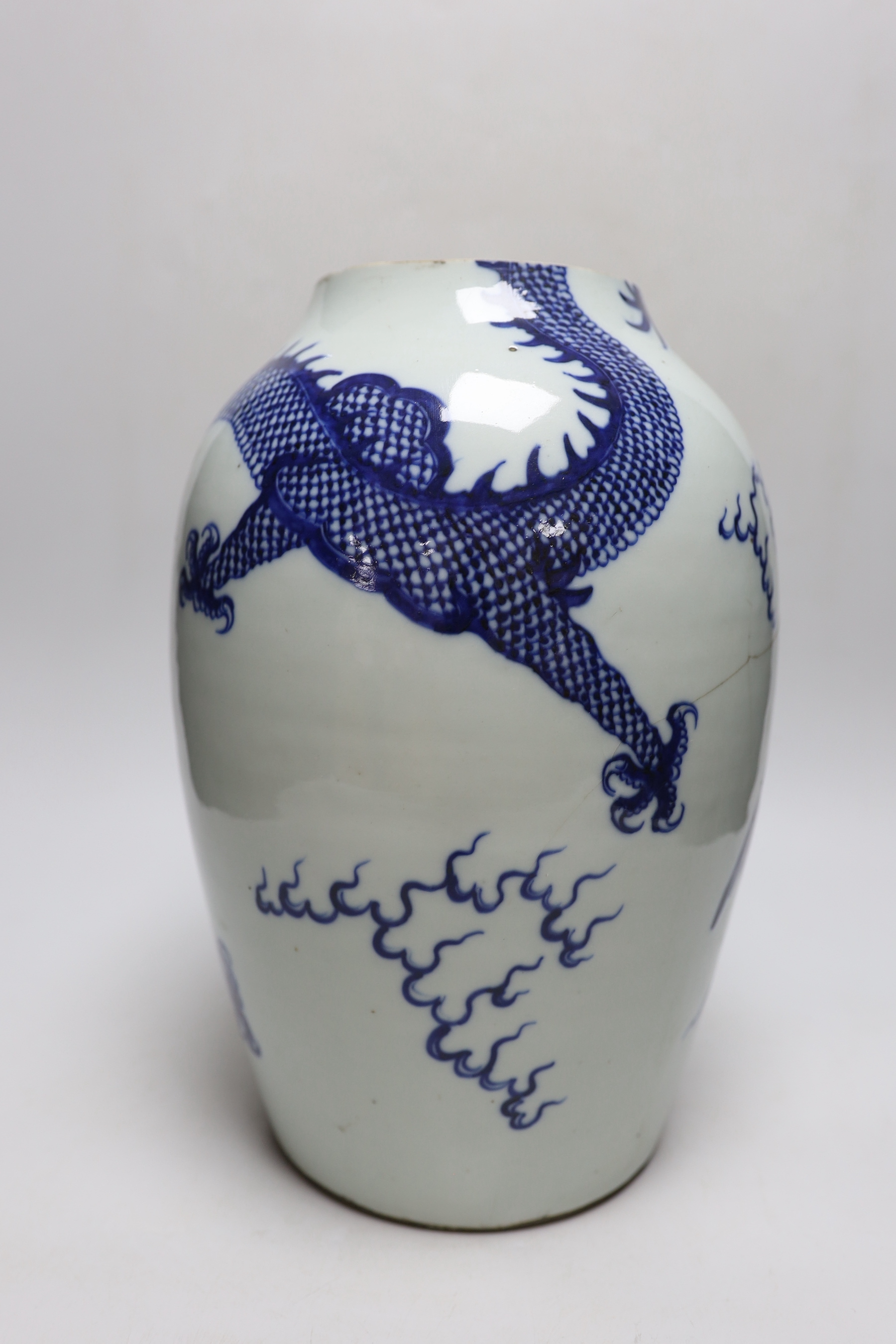 A Chinese blue and white ‘dragon’ vase, Qing dynasty, neck cut down, 33cm high